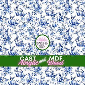 May include: A white background featuring a blue floral and rabbit pattern. The design includes illustrations of rabbits, flowers, and butterflies. The text "CAST Acrylic and MDF Wood" is displayed in a green banner.