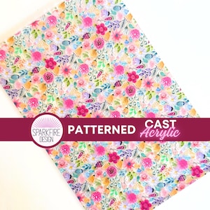 May include: A sheet of patterned cast acrylic with a floral design. The pattern features pink, yellow, and blue flowers with green leaves on a light background. The text "PATTERNED" and "CAST Acrylic" are displayed on a burgundy banner.
