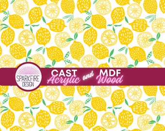 May include: A white background is covered with a repeating pattern of yellow lemons and lemon slices with green leaves. The image includes the text "CAST Acrylic and MDF Wood" and the Sparkfire Design logo.