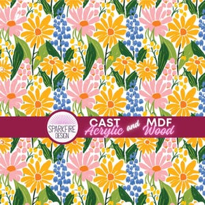 May include: A colourful floral pattern with yellow and pink daisies, blue bellflowers, and green leaves on a white backdrop. The design includes the text "CAST Acrylic and MDF Wood" and the "SPARKFIRE DESIGN" logo.