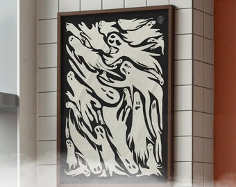 May include: A framed art print featuring a black background with numerous white ghost illustrations. The ghosts have various shapes and expressions. The frame is a dark brown color. The artwork is displayed on a white tiled wall.