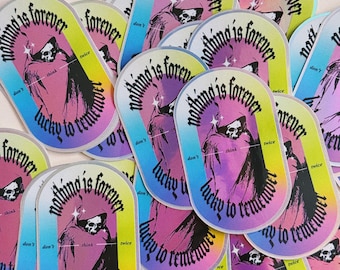 May include: A collection of colorful stickers with a gothic aesthetic. Each sticker features a hooded figure with the text "Nothing is forever, lucky to remember" in a gothic font.