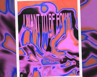May include: A poster with a pink, blue, and black abstract background. The text "I WANT TO BE FOUND" is written in white letters on the poster.