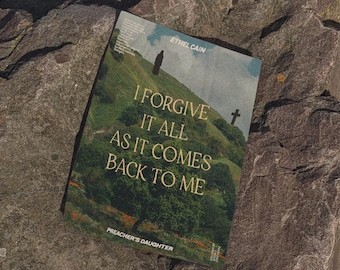 May include: A rectangular poster featuring a landscape of green hills and trees under a cloudy sky. The text reads ETHEL CAIN, I FORGIVE IT ALL AS IT COMES BACK TO ME, and PREACHER'S DAUGHTER. A silhouette of a person and a cross are visible on the hill.