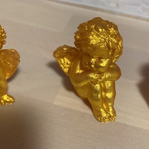 Little golden angel in resin