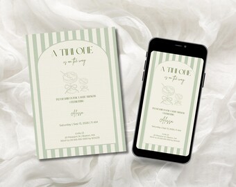 May include: An invitation and a smartphone displaying the same design. The invitation is light green with vertical stripes and features the text "A TINY ONE is on the way." The phone screen mirrors the invitation's design, ideal for digital sharing.
