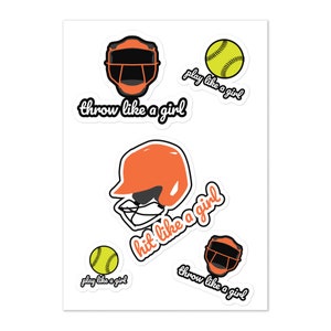 May include: Five stickers featuring a softball player wearing a catcher's mask and helmet. The stickers have the text "play like a girl", "throw like a girl", and "hit like a girl".