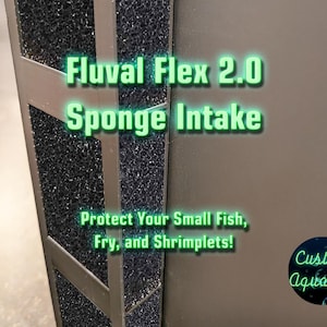 May include: A close-up of a Fluval Flex 2.0 Sponge Intake. The image features a black sponge filter with a silver frame. Text on the image reads "Protect Your Small Fish, Fry, and Shrimplets!" and "Custom Aquatics."