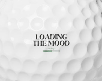 May include: A white golf ball with the text "LOADING THE MOOD" and a progress bar that says "loading..." printed on it.