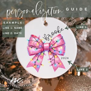 May include: A pink glitter bow with colorful lights, a personalized Christmas ornament with the name "Brooke" and the year "2024" on it.
