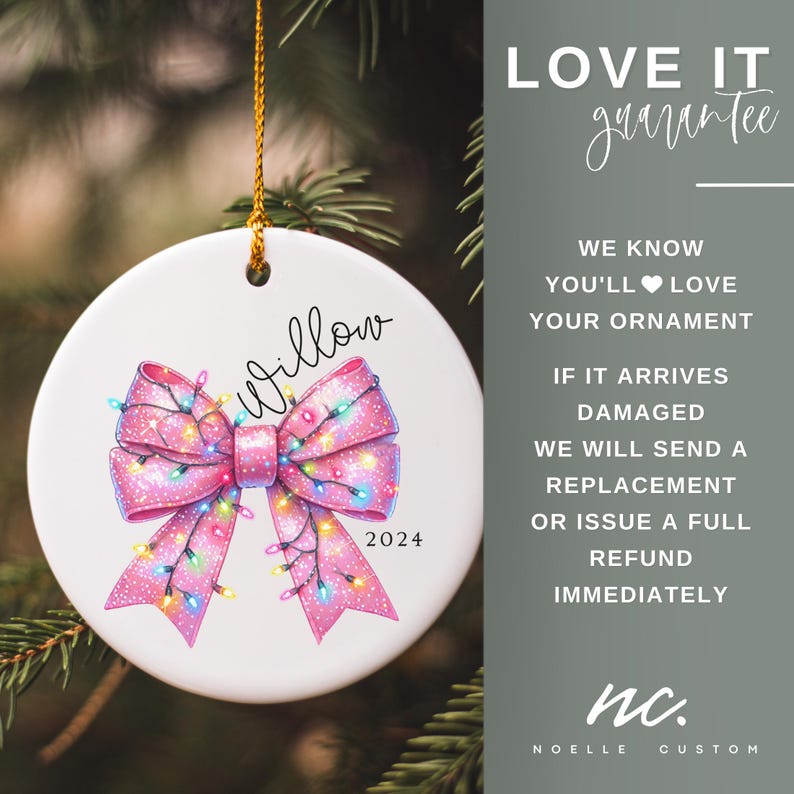 May include: A white ceramic Christmas ornament with a pink bow decorated with colorful lights. The ornament has the name "Willow" and the year "2024" written on it. The ornament is hanging from a gold string.