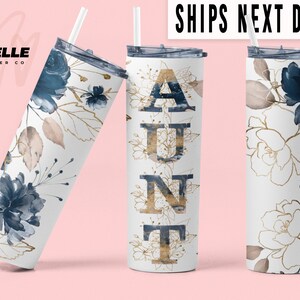 May include: A white tumbler with a blue and gold floral design and the word "AUNT" in gold letters.