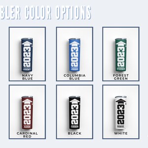 May include: Six different color options for a 2023 graduation tumbler. The colors are navy blue, columbia blue, forest green, cardinal red, black, and white. Each tumbler has a white graduation cap and the year 2023 printed on it.
