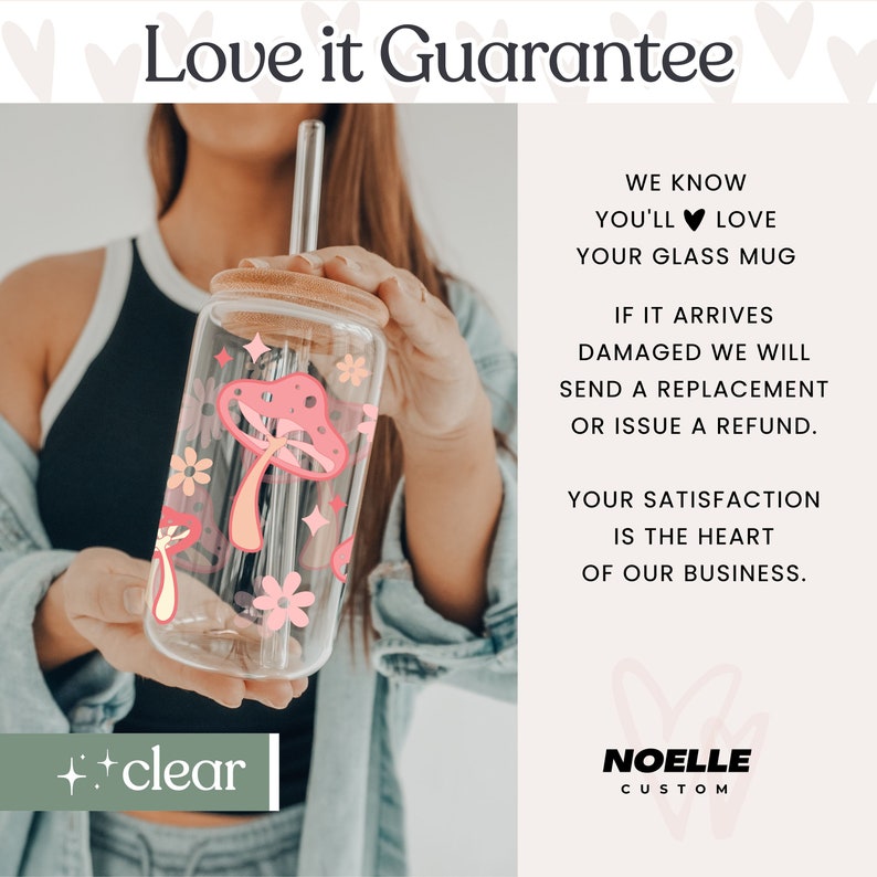 May include: A clear glass mug with a pink mushroom and floral design. The mug has a bamboo lid and a reusable straw. The text "Love it Guarantee" and "++clear" are visible in the image.