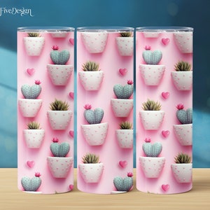 May include: Three pink stainless steel tumblers with a repeating pattern of cactus plants in white pots with pink polka dots and pink hearts.