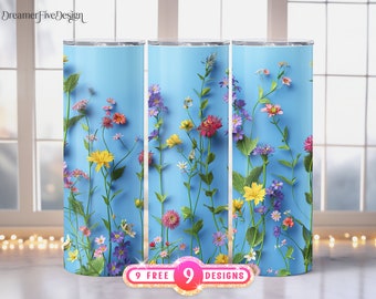 Puede incluir: Tres vasos de acero inoxidable con fondo azul y un diseño floral con flores rosas, amarillas y moradas. Los vasos están dispuestos en fila con el texto "9 FREE 9 DESIGNS" en la parte inferior.