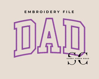 May include: An embroidery file design featuring the word DAD in large, purple-outlined block letters on a light beige background. Below the text, the letters SC appear in black with the text SUNNY CREEK ROAD underneath in a smaller font.