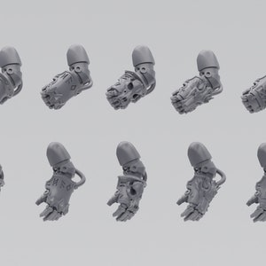 Puede incluir: Diez brazos de robot de plástico impresos en 3D con diferentes diseños. Los brazos son grises y tienen una superficie texturizada.