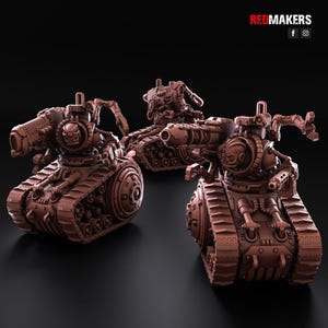 May include: Three brown miniature tanks with intricate mechanical designs. Each tank features a skull emblem, multiple barrels, and articulated arms. The tanks are set against a dark background, with the text "REDMAKERS" visible in the top right corner.
