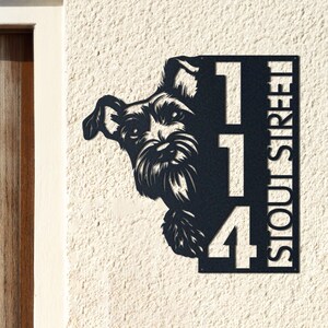May include: Black metal house sign with a Schnauzer dog design. The sign shows the number "114" and the street name "STOUT STREET" vertically. It is mounted on a textured, off-white wall, suitable for outdoor use.