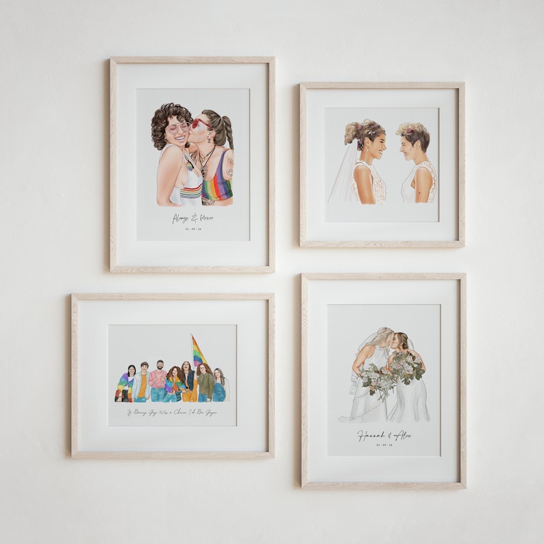 May include: Four framed art prints featuring watercolor illustrations of couples and groups. The prints depict same-sex couples in various settings, including a wedding and a kiss. The prints are in light wood frames.