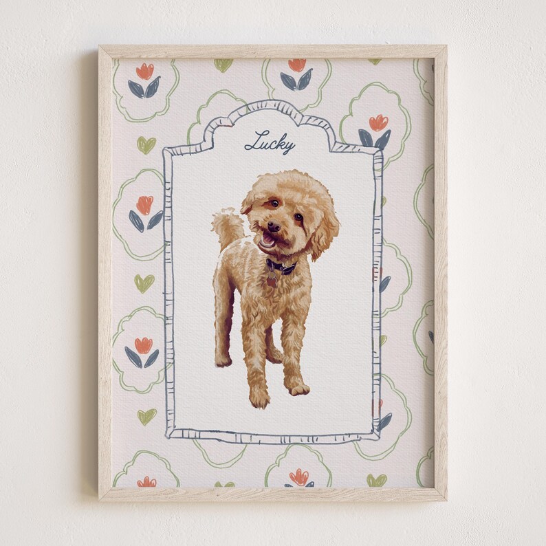 May include: A framed print featuring a tan poodle with the name "Lucky" above the dog. The background has a floral pattern with red, blue, and green accents. The frame is light wood.