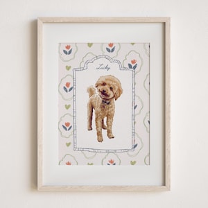 May include: A framed print featuring a tan poodle illustration. The dog is wearing a black collar and is centered within a decorative frame. The background has a floral pattern with the name "Lucky" above the dog.