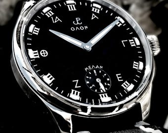 ΟΛΟΝ Melan-handopwinder: zwarte geëmailleerde wijzerplaat, roestvrijstalen kast