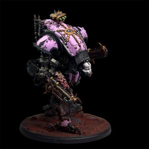 May include: A detailed miniature model of a war machine, primarily in shades of pink and black, with gold accents. The model features intricate mechanical details, a skull-like head, and a weathered, battle-worn appearance. It stands on a textured, reddish-brown base.