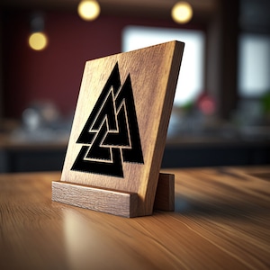 May include: A wooden sign with a black Valknut symbol, a Norse symbol representing the connection between the realms of the gods, the living, and the dead. The sign is on a wooden stand.