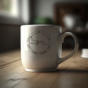 May include: White ceramic mug with a black and white design of a hand pointing to a circle with Hebrew text and a star of David. The text reads "אלוהים" and "אל" in Hebrew.