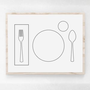 May include: A rectangular wall art print in a light wood frame featuring a minimalist line drawing of a place setting. The design includes a fork inside a rectangle, a large circle representing a plate, a small circle for a cup, and a spoon.