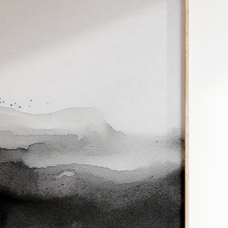 May include: Abstract watercolor painting with a gradient of black and white. The painting features a series of overlapping, layered shapes that resemble mountains or clouds. The background is a light gray, and the foreground is a dark black.