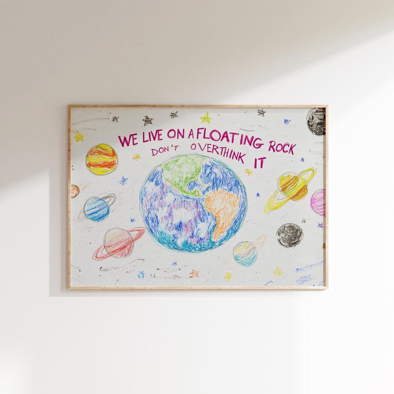May include: A colorful drawing of the Earth with planets and stars surrounding it. The text reads "We live on a floating rock don't overthink it".