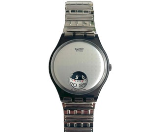 New and unworn vintage 1995 Swatch Gent Flex SILVER PLATE size medium / large band - new battery installed - 34mm