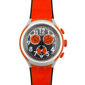 May include: A Swatch chronograph wristwatch featuring a black dial with white Arabic numerals, three orange sub-dials, and orange hands. The watch has a silver-toned case and a bright orange silicone strap with black edges and two orange side buttons.