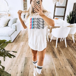 a woman taking a selfie in a living room