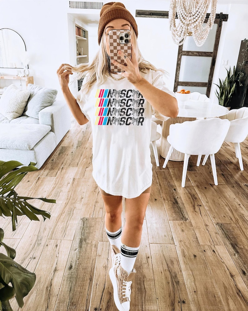 a woman taking a selfie in a living room