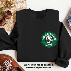 a black sweatshirt with a starbucks logo on it