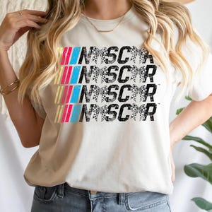 a woman wearing a t - shirt that says inscor inscor inscor ins