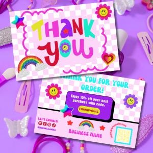 May include: Two pink and white checkered thank you cards with the words "THANK YOU" in colorful bubble letters. The cards feature a rainbow, stars, and smiley face flower graphics. One card says "THANK YOU FOR YOUR ORDER!" and includes a discount code.