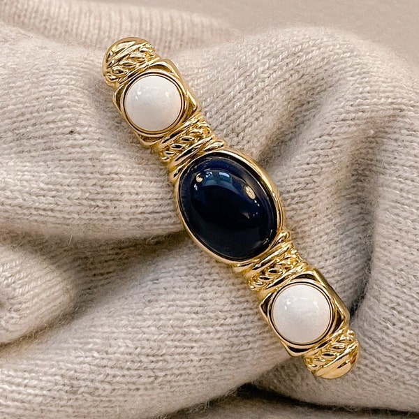 Monet Gold Brooch With Dark Blue and White stones.