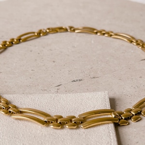 Monet gouden choker met lange schakels