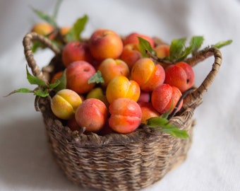 Miniature peaches in the basket