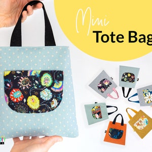 May include: A set of six mini tote bags in various colors and patterns. Each bag has a small pocket with a floral print. The bags are arranged in a circle on a white surface. The text "Mini Tote Bag" is visible in the upper right corner of the image.