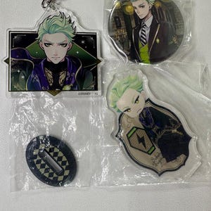 May include: A set of three ceramic mugs with a speckled, matte finish. The mugs are in shades of cream, light gray, and dark gray. Each mug has a simple, minimalist design and a rounded handle.