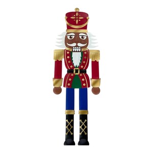 May include: A decorative nutcracker figurine with a red and gold uniform, black boots, and blue pants. The nutcracker has a white mustache and hair, and a dark skin tone. The figurine is a festive holiday decoration.