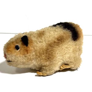 May include: A rustic wooden sign with the text "Welcome to our home" in white lettering. The sign features a distressed finish and a simple, inviting design, perfect for entryway decor.