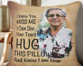 May include: A beige pillow with a photo of an older woman and the text "I Know You MISS ME I Can See Your Tears HUG THIS PILLOW And Know I am Near".