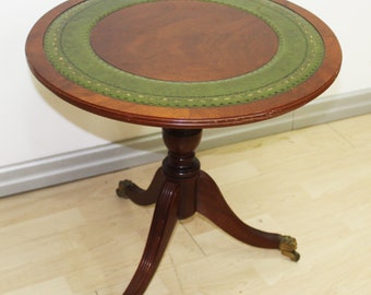 Mahogany coffee table, English green leather top, lion's paws on wheels Vintage Regency style table